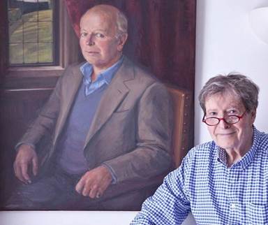 John Copley with a portrait of his late husband, John Healey.