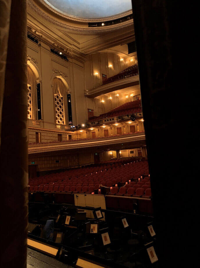 A world of possibility. Peeking out to an expectant house on the evening of our first performance back, August 21.