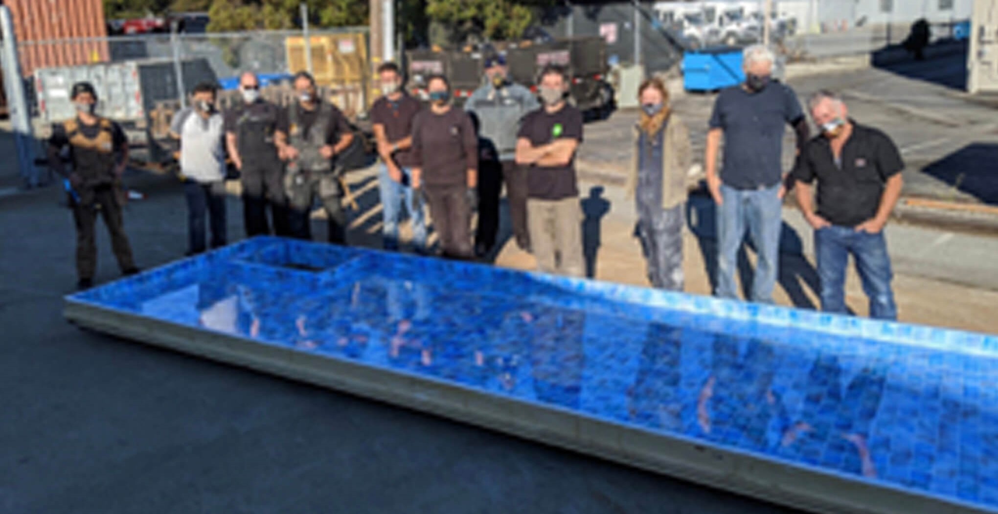 Members of the San Francisco Opera Scene Shop with the swimming pool for Cos&igrave; fan tutte