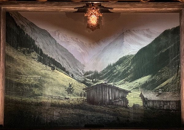 The Hansel and Gretel show drop featuring a stylized painting of a turn of the century German mountain cottage, inspired by imagery from that period. (Note the fabulous cuckoo clock that frames the opera throughout!).&nbsp;