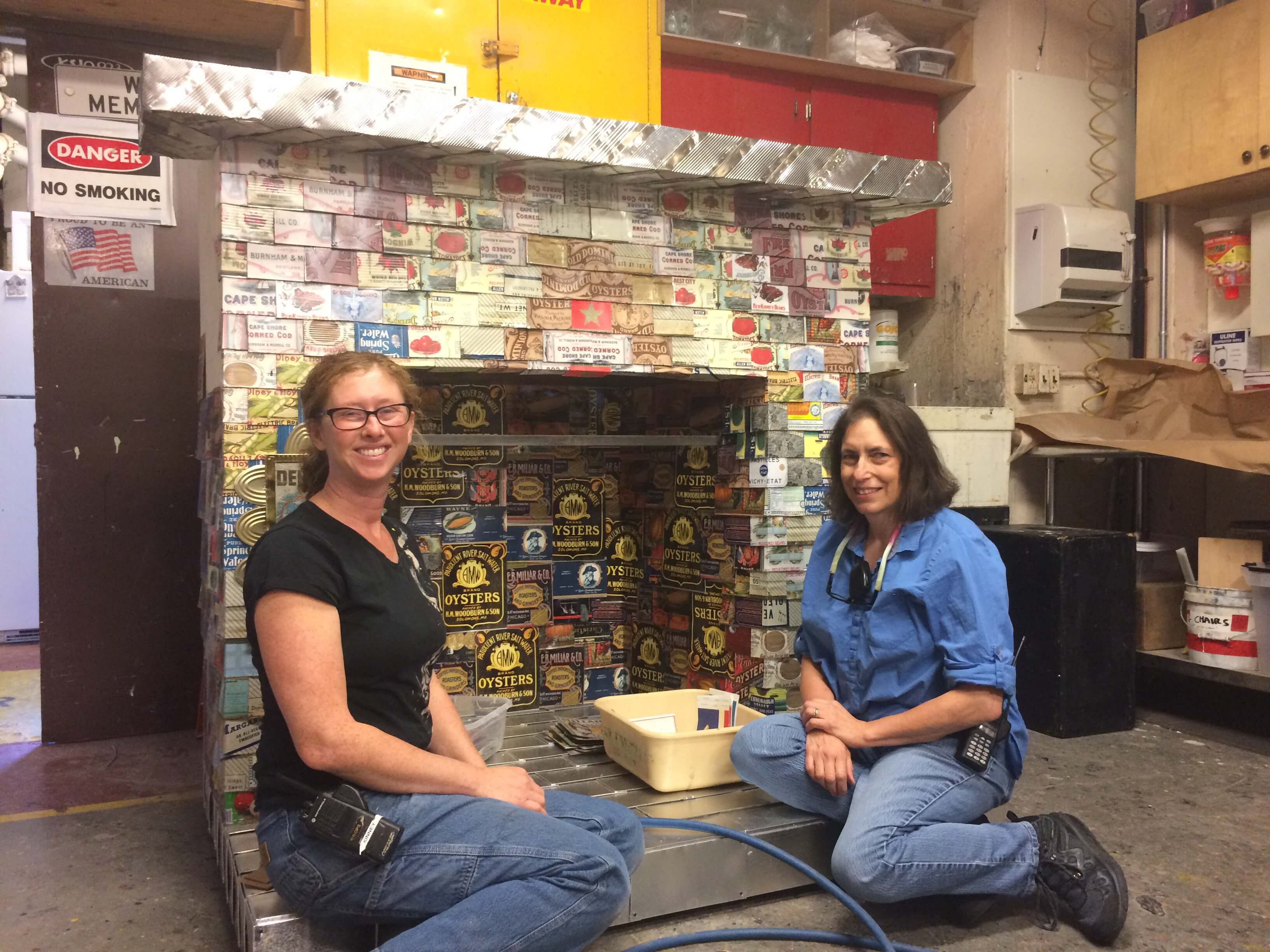 Sarah Shores and Lori Harrison with Dame Shirley&rsquo;s fireplace: a work of art in progress.